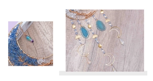 Close-up of tree of life suncatcher with blue agate slices and moon pendants