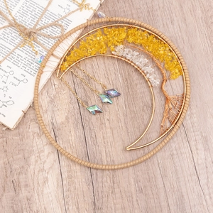 Handmade moon-shaped tree of life wall hanging with yellow crystal stones on wood