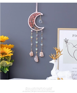 Detail of pink moon dream catcher with handmade life tree and crystal stones