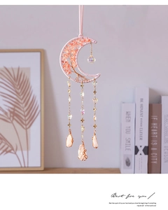Detail of pink moon dreamcatcher with tree of life weaving and crystal stones
