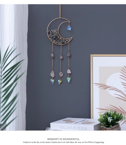 Bohemian gold crescent moon suncatcher with purple crystal stones and heart prisms