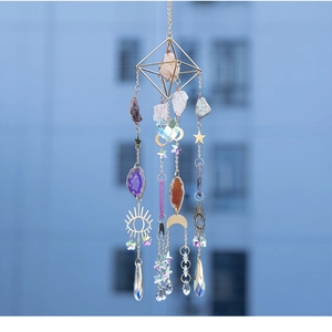 Detail of sun catcher with green aventurine, crystals, and gold celestial charms