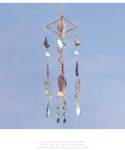 Close-up of bohemian sun catcher with green aventurine, crystal beads and moon charm