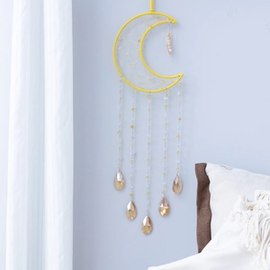 Moon shaped yellow woven dream catcher with colorful crystal stones for home decor