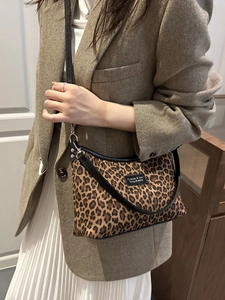 Chic leopard print shoulder bag for women with black strap and leather logo patch