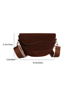Deep brown suede saddle bag with wide shoulder strap and product dimensions diagram
