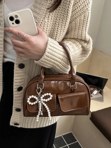 Brown large capacity leather shoulder bag with front double pockets and pearl bow charm