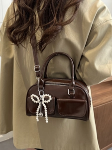 Deep coffee glossy patent leather shoulder bag with chic pearl bow charm for women