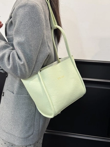 Chic mint green lychee pattern leather tote bag with gold lettering for stylish women