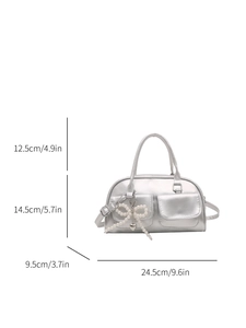 Silver metallic shoulder bag with pearl bow heart charm and size specifications