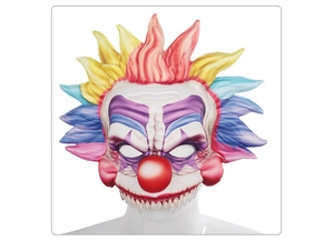 Detailed view of scary Halloween clown mask with colorful hair and sharp teeth