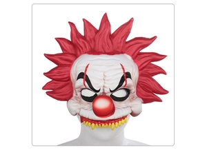 Detailed view of the scary clown mask with red hair and sharp yellow teeth for cosplay