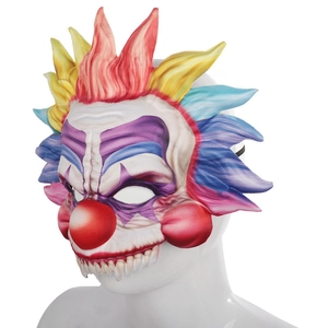 Creepy Halloween clown mask with colorful hair and sharp teeth on a white mannequin head