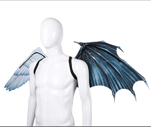 Detail of asymmetric angel and demon wings for Mardi Gras with feather and lightning patterns