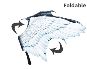 Detailed view of large white feather wings with black tips featuring foldable mechanism