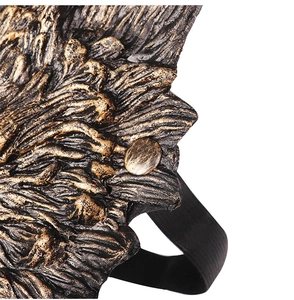 Detailed macro view of the realistic wolf mask texture and metallic bronze finish rivet