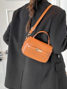 Borsa a mano minimalista arancione da donna con chiusura a scatto in metallo dorato