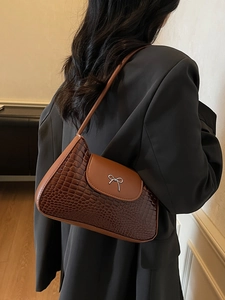 Fashionable dark brown crocodile pattern shoulder bag with a silver bow clasp for women