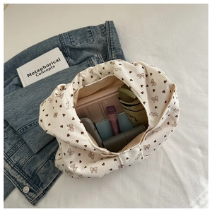 Top view of spacious corduroy tote bag showing interior storage for books and accessories
