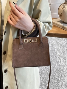 Vintage dark brown matte leather handbag with gold clasp and adjustable shoulder strap
