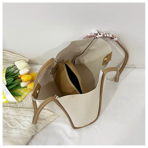 Top view of cream tote bag showing spacious interior with brown zippered inner pouch
