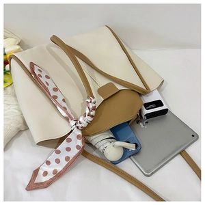 Interior view of tote bag with tablet and umbrella showing spacious daily capacity