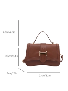 Brown leather handbag with curved base and dimensions: 21cm x 13.5cm x 7cm
