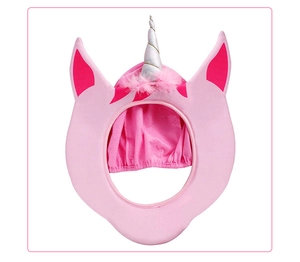 Detail of pink unicorn headwear with white spiral horn and fluffy faux fur trim
