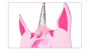 Detailed macro view of pink plush unicorn headband with a silver spiral horn and soft ears