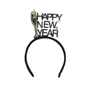 Detail of Happy New Year headband with black and gold glitter letters and champagne glass