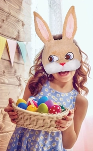 Close-up of a child wearing a plush brown bunny mask for Easter party celebration
