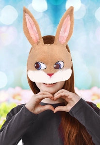 Detail of plush rabbit mask featuring realistic faux fur and blue cartoon eyes for parties