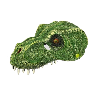 Close-up of realistic 3D green dinosaur mask with detailed scales and sharp teeth