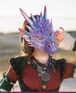 Detailed side view of 3D pearlescent blue and purple dragon mask with intricate scales