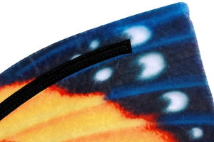 Detail of soft fabric butterfly wings with vibrant orange and blue gradient pattern