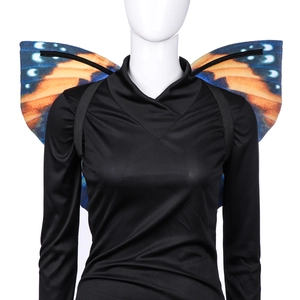 Detail of vibrant orange and blue printed butterfly wings with black elastic straps