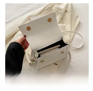 Internal capacity of the white leather rectangular crossbody bag with dual magnetic snaps