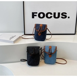 Three patchwork denim crossbody bags in blue and black with vintage toggle closures