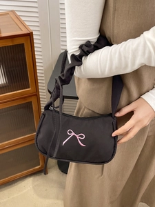 Chic black shoulder bag with pink butterfly embroidery and scrunchie-style straps
