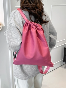 Pink nylon drawstring backpack for women, lightweight folding travel bag for daily use