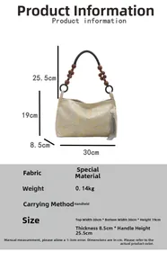 Detail view of jacquard handbag dimensions 30x19x8.5cm with beaded handle and tassel