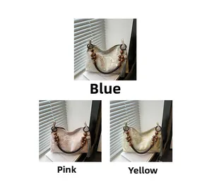 Detailed close-up of ethnic jacquard handbags with floral patterns and wooden bead handles