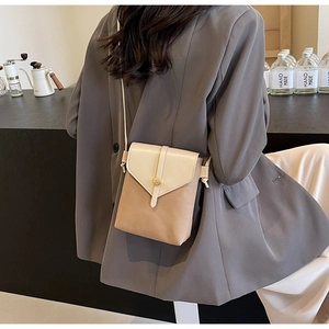 Detail of khaki colorblock crossbody phone bag with pebble leather and metal buckle