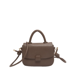 Brown litchi grain leather crossbody bag with top handle and knotted strap detail