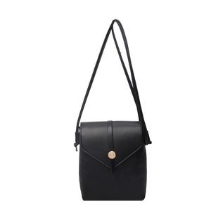 Minimalist black pebble leather crossbody square bag with gold buckle and slim strap
