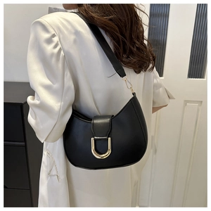 Elegant black hobo shoulder bag with crescent shape and gold horseshoe hardware decoration