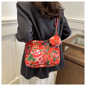 Detail of red floral tote bag with matching coin purse and traditional peony pattern