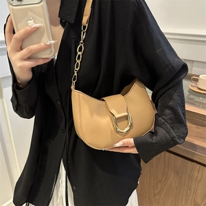 Chic camel half-moon shoulder bag with gold D-ring buckle and metal chain strap