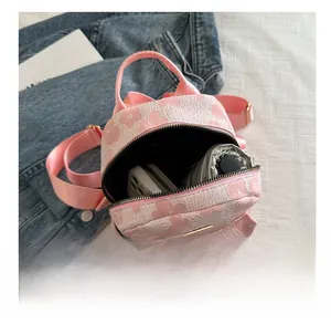 Interior view of floral embroidery backpack showing space for umbrella and phone