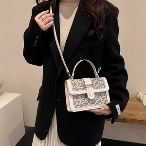 Classic monogram crossbody bag in beige leather with stylish top handle and gold hardware